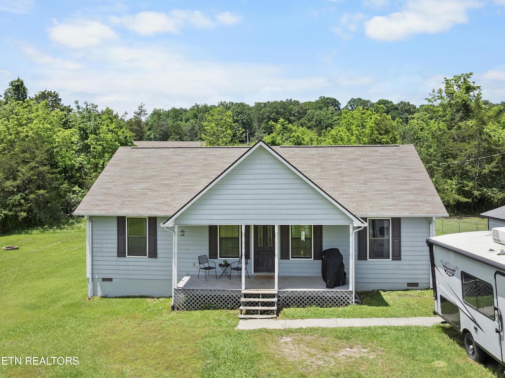 153 Mill Creek Ln, Jacksboro, TN 37757 - view of front of house featuring crawl space, a front lawn, covered porch, and roof with shingles