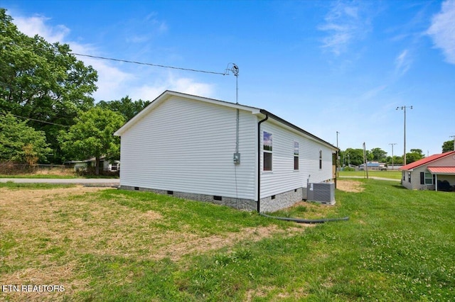 708 E Elm St, Lafollette, TN 37766 - view of home's exterior with crawl space, central air condition unit, and a lawn