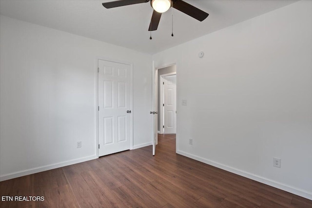 708 E Elm St, Lafollette, TN 37766 - unfurnished bedroom with wood finished floors, baseboards, and ceiling fan