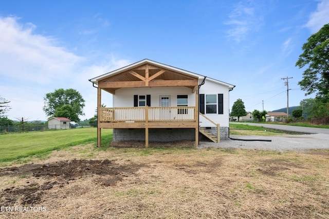 708 E Elm St, Lafollette, TN 37766 - back of property featuring covered porch, crawl space, and stairway