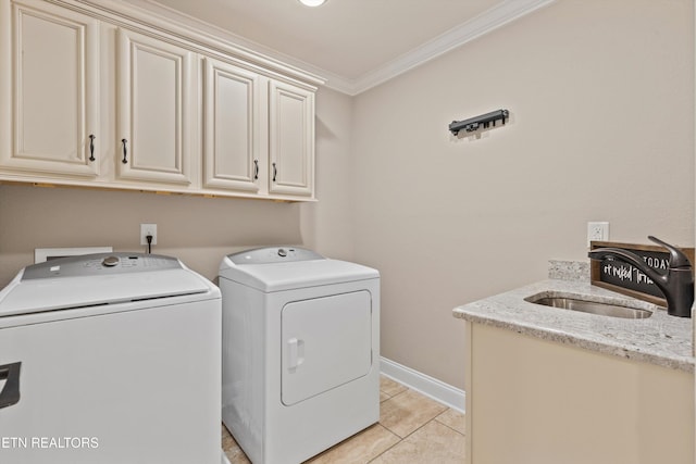1017 Brighton Dr, Alcoa, TN 37701 - laundry area with cabinet space, washing machine and dryer, crown molding, light tile patterned flooring, and baseboards