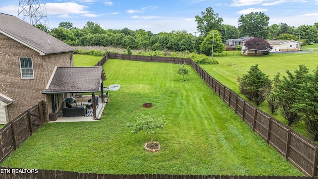1017 Brighton Dr, Alcoa, TN 37701 - view of yard featuring a patio area and view of wooded area