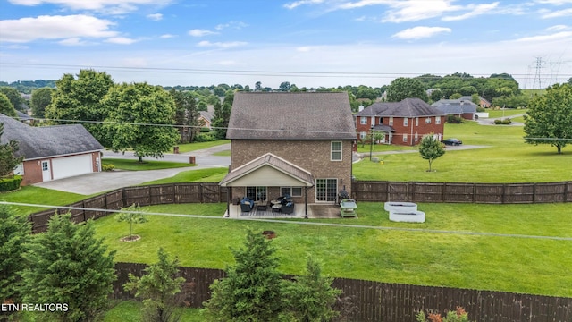 1017 Brighton Dr, Alcoa, TN 37701 - back of property featuring brick siding, a garage, a patio area, and driveway