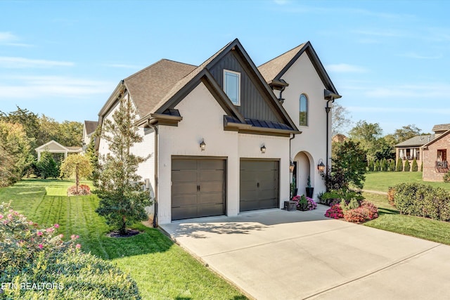211 Cool Springs Blvd, Knoxville, TN 37934 - view of front of house with driveway, an attached garage, a front yard, stucco siding, and a standing seam roof