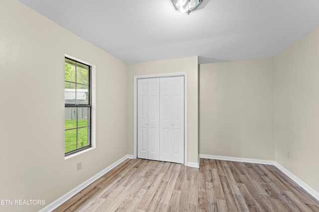 292 Buckner Rd, Philadelphia, TN 37846 - unfurnished bedroom with wood finished floors, a closet, and baseboards