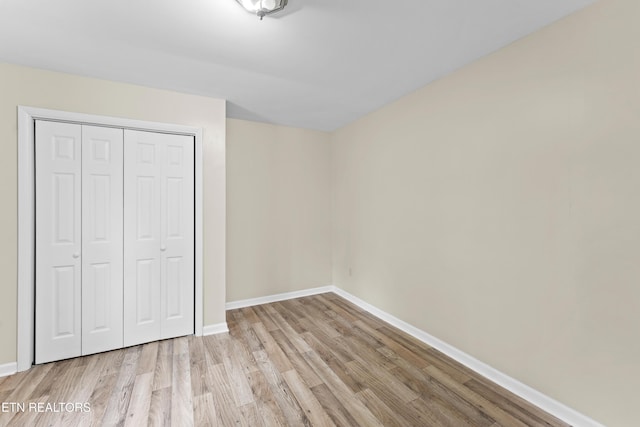 292 Buckner Rd, Philadelphia, TN 37846 - unfurnished bedroom with wood finished floors, baseboards, and a closet