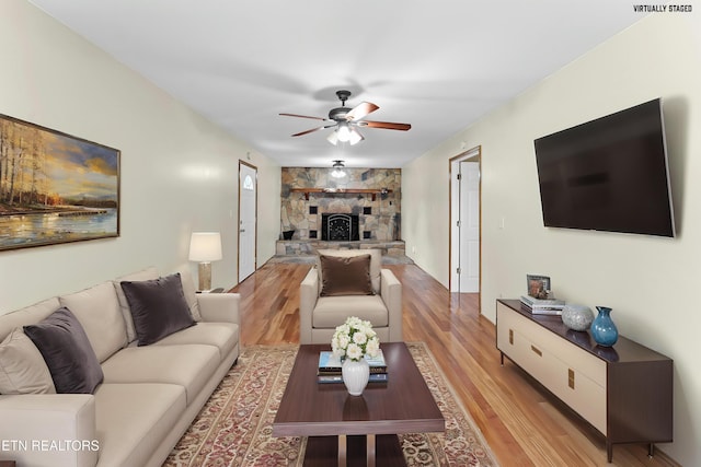 292 Buckner Rd, Philadelphia, TN 37846 - living area featuring ceiling fan, light wood-style floors, and a fireplace