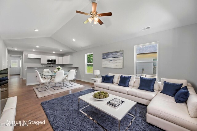 1219 NW Dakota Ave, Knoxville, TN 37921 - living area featuring wood finished floors, lofted ceiling, a ceiling fan, baseboards, and recessed lighting