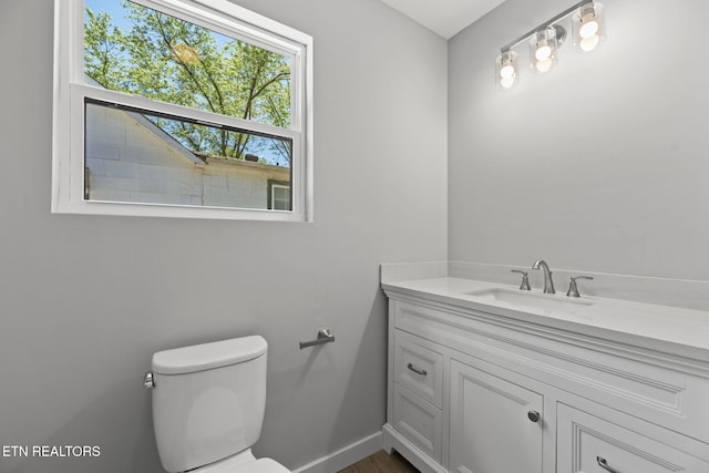 1219 NW Dakota Ave, Knoxville, TN 37921 - bathroom with toilet, vanity, and baseboards
