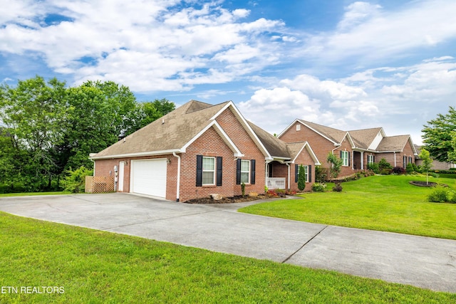 1625 Linden Hall Dr, Alcoa, TN 37701 - view of front of property with brick siding, an attached garage, concrete driveway, and a front yard