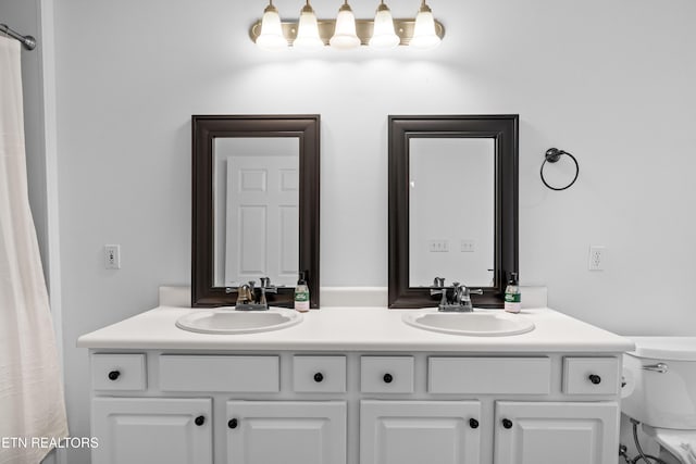 1625 Linden Hall Dr, Alcoa, TN 37701 - bathroom with double vanity and toilet