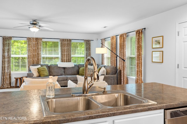 1625 Linden Hall Dr, Alcoa, TN 37701 - kitchen with dishwasher, open floor plan, a ceiling fan, dark countertops, and white cabinets