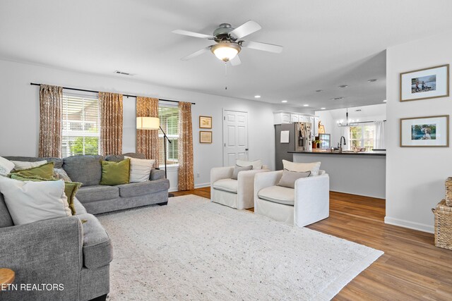 1625 Linden Hall Dr, Alcoa, TN 37701 - living area featuring a chandelier, wood finished floors, ceiling fan, plenty of natural light, and recessed lighting