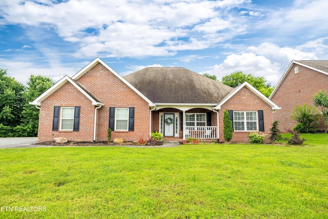 1625 Linden Hall Dr, Alcoa, TN 37701 - view of front of property featuring a porch, brick siding, and a front yard