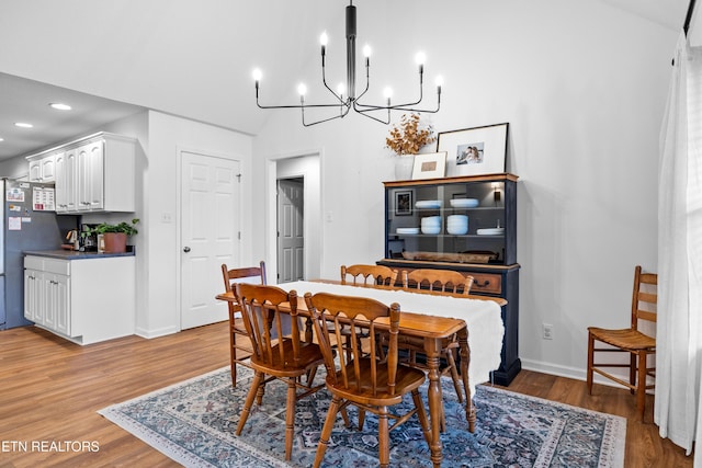 1625 Linden Hall Dr, Alcoa, TN 37701 - dining area with a chandelier, light wood finished floors, recessed lighting, and vaulted ceiling
