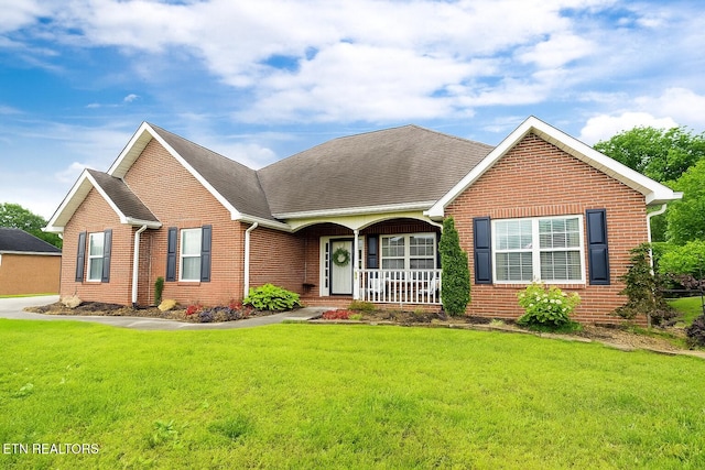 1625 Linden Hall Dr, Alcoa, TN 37701 - view of front facade featuring brick siding, a porch, and a front yard