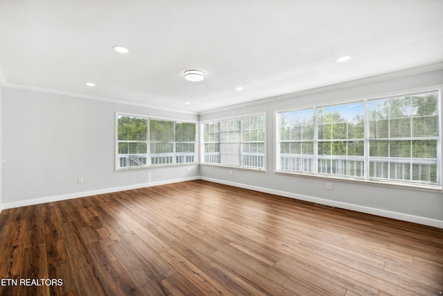 566 Allyson Dr, Kodak, TN 37764 - unfurnished room featuring crown molding, baseboards, dark wood-style floors, and recessed lighting