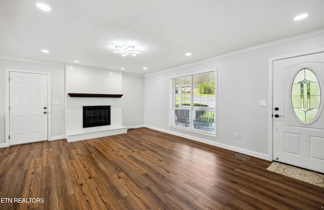 566 Allyson Dr, Kodak, TN 37764 - entrance foyer with ornamental molding, baseboards, dark wood finished floors, a glass covered fireplace, and recessed lighting