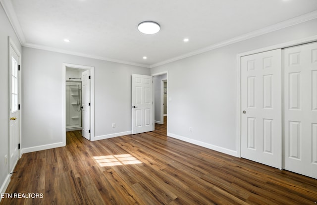 566 Allyson Dr, Kodak, TN 37764 - unfurnished bedroom with baseboards, recessed lighting, dark wood-style flooring, crown molding, and a closet