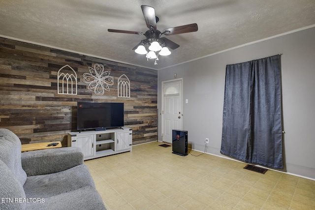 883 Old Harriman Hwy, Harriman, TN 37748 - living area with wooden walls, baseboards, a ceiling fan, a textured ceiling, and light flooring