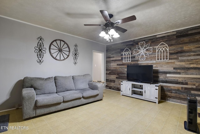883 Old Harriman Hwy, Harriman, TN 37748 - living area featuring wood walls, ceiling fan, crown molding, and a textured ceiling