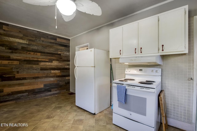 883 Old Harriman Hwy, Harriman, TN 37748 - kitchen featuring white appliances, under cabinet range hood, wood walls, ornamental molding, and white cabinets