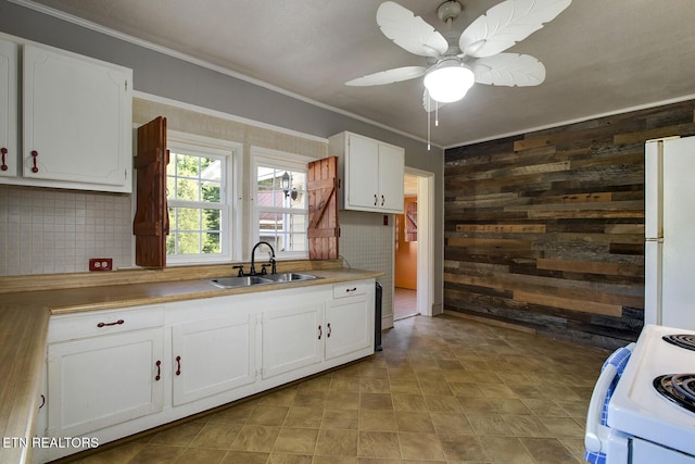 883 Old Harriman Hwy, Harriman, TN 37748 - kitchen with a sink, wooden walls, white appliances, crown molding, and white cabinetry