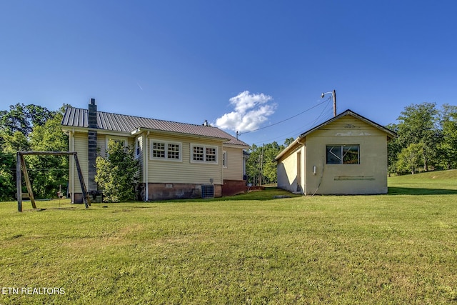 883 Old Harriman Hwy, Harriman, TN 37748 - rear view of property featuring crawl space, a lawn, cooling unit, metal roof, and a chimney