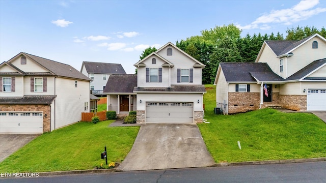9934 Thunderbolt Way, Knoxville, TN 37923 - view of front facade featuring a front yard, an attached garage, concrete driveway, and stone siding