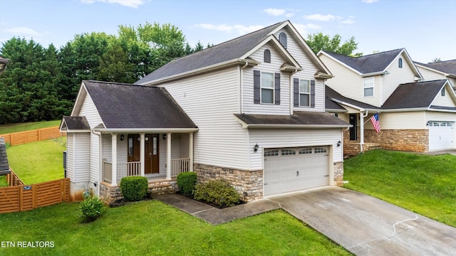 9934 Thunderbolt Way, Knoxville, TN 37923 - view of front facade with a porch, driveway, a garage, stone siding, and a shingled roof