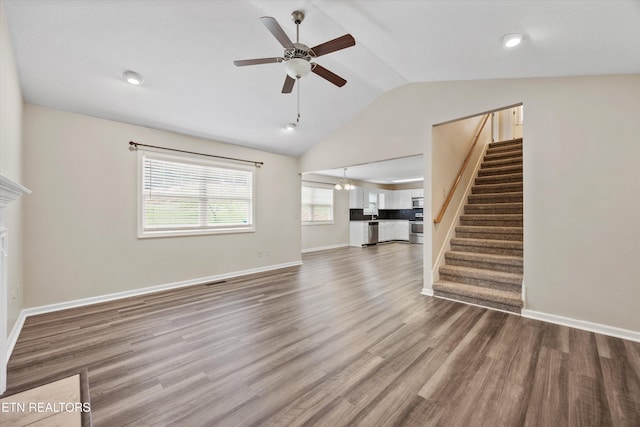 9934 Thunderbolt Way, Knoxville, TN 37923 - unfurnished living room featuring a ceiling fan, vaulted ceiling, stairs, wood finished floors, and baseboards