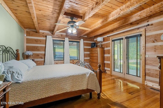 257 Copenhaver Rd, Lenoir City, TN 37771 - bedroom with wooden ceiling with exposed beams, wood walls, wood finished floors, and access to exterior