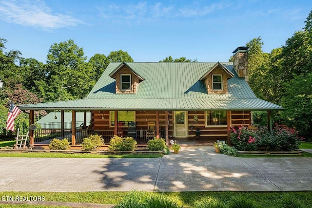 257 Copenhaver Rd, Lenoir City, TN 37771 - view of front of home with a porch, metal roof, and a chimney