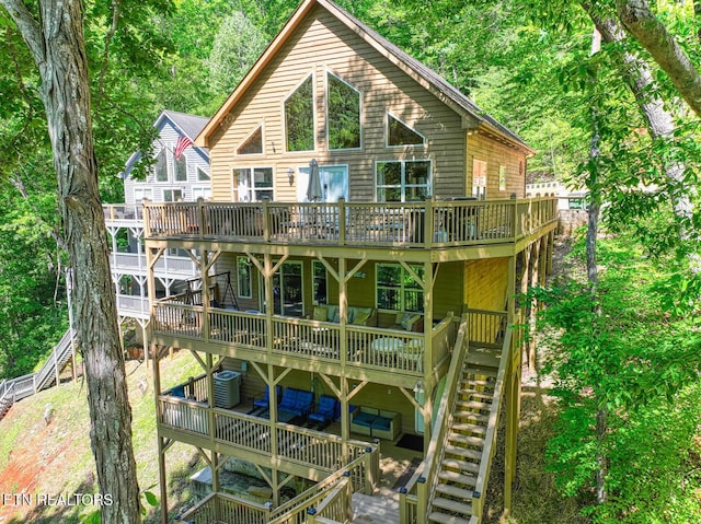 129 Bridgeview Ln, Lafollette, TN 37766 - rear view of property featuring a wooden deck and stairs