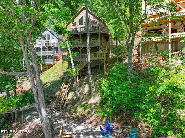 129 Bridgeview Ln, Lafollette, TN 37766 - back of house featuring stairs and a balcony