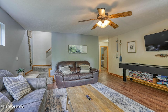129 Bridgeview Ln, Lafollette, TN 37766 - living room with wood finished floors, stairway, a ceiling fan, and baseboards
