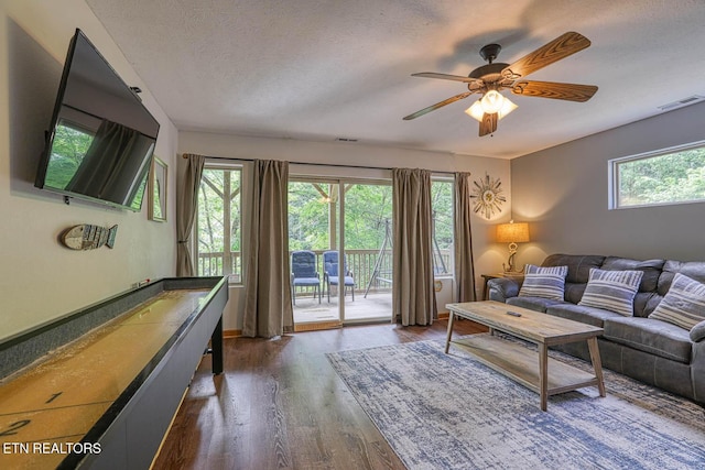 129 Bridgeview Ln, Lafollette, TN 37766 - living room with wood finished floors, a ceiling fan, and a textured ceiling