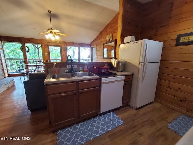2859 Eagle Crest Way, Sevierville, TN 37876 - kitchen featuring white appliances, a sink, plenty of natural light, wood walls, and wood finished floors