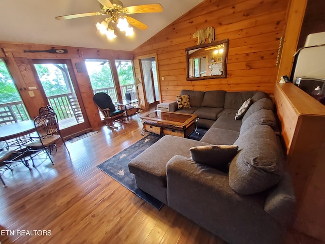 2859 Eagle Crest Way, Sevierville, TN 37876 - living room with lofted ceiling, wood finished floors, wooden walls, and a ceiling fan