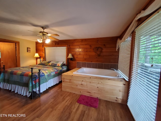 2859 Eagle Crest Way, Sevierville, TN 37876 - bedroom featuring wood finished floors, wood walls, and a ceiling fan