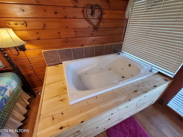 2859 Eagle Crest Way, Sevierville, TN 37876 - full bathroom with a jetted tub, wood walls, and wood finished floors