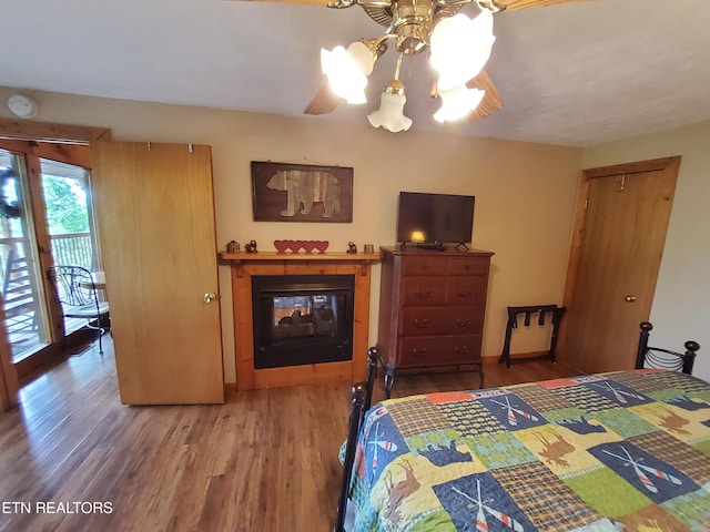 2859 Eagle Crest Way, Sevierville, TN 37876 - bedroom featuring wood finished floors, a chandelier, access to exterior, and a ceiling fan