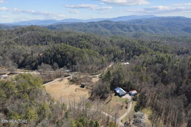 6131 Happy Valley Loop, Tallassee, TN 37878 - aerial view of property and surrounding area featuring a heavily wooded area and a mountain backdrop