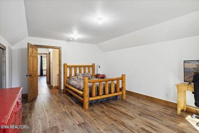 6131 Happy Valley Loop, Tallassee, TN 37878 - bedroom with vaulted ceiling, wood finished floors, and baseboards