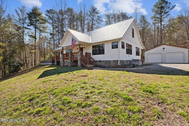 6131 Happy Valley Loop, Tallassee, TN 37878 - view of home's exterior featuring an outdoor structure, a detached garage, a lawn, metal roof, and a porch