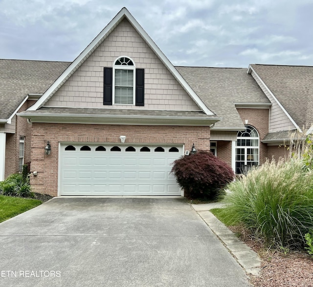 1077 Creekside Village Way, Seymour, TN 37865 - view of front facade with brick siding, driveway, and a shingled roof