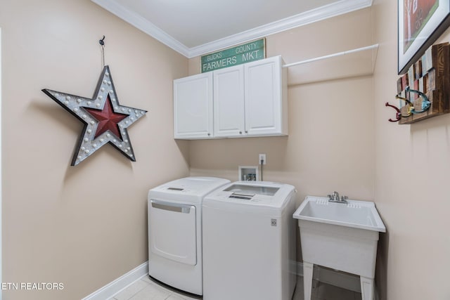 1077 Creekside Village Way, Seymour, TN 37865 - laundry area featuring cabinet space, separate washer and dryer, ornamental molding, baseboards, and light tile patterned floors