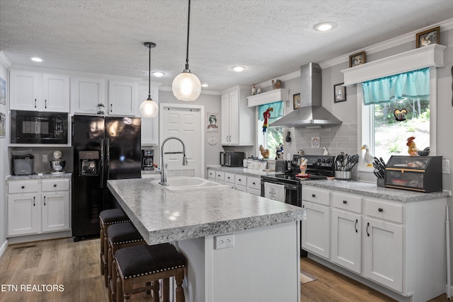 235 Neely Dr, New Tazewell, TN 37825 - kitchen featuring wall chimney range hood, a sink, black appliances, light countertops, and ornamental molding