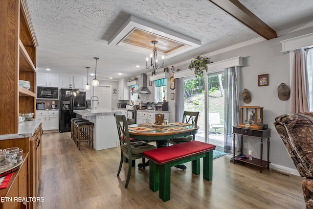 235 Neely Dr, New Tazewell, TN 37825 - dining room with light wood-style flooring, a textured ceiling, a chandelier, recessed lighting, and ornamental molding
