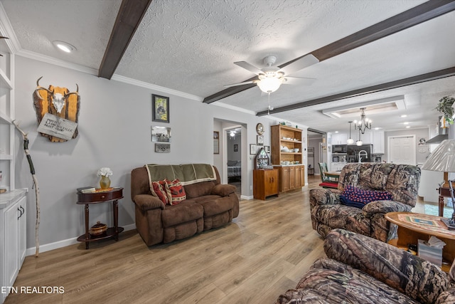 235 Neely Dr, New Tazewell, TN 37825 - living room featuring light wood-type flooring, a chandelier, a textured ceiling, a ceiling fan, and beamed ceiling